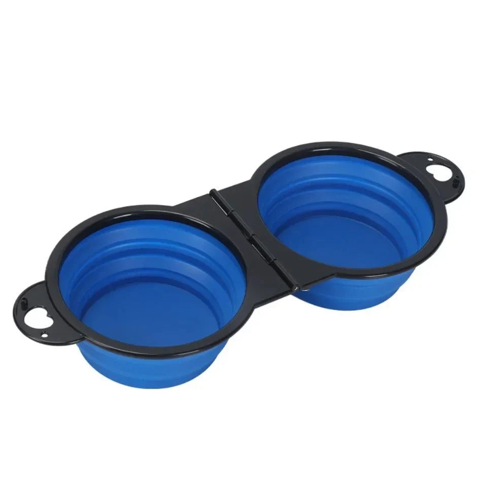 Blue dual pet feeding and drinking bowl: two open dishes with black hinge supports