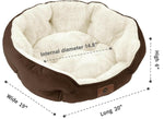 Round pet bed with brown sides and cream sherpa-style inner cushion