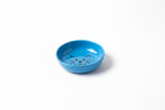 Blue cat food bowl with cat-face pattern, shallow round shape