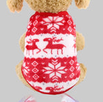 Pet fleece vest in red with white winter animal and snowflake patterns