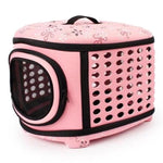 Foldable pet carrier handbag in pink with perforated vents and round mesh window