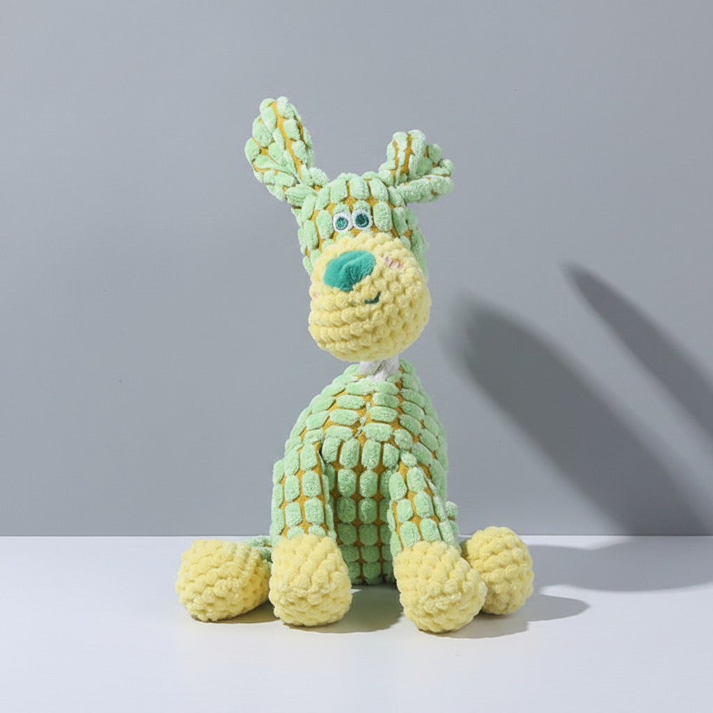 Plush squeaky bunny dog toy in light green with teal nose and long ears.