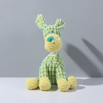 Plush squeaky bunny dog toy in light green with teal nose and long ears.