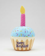Plush birthday dog toy cupcake with blue top, pink candle, and 'Happy Birthday' print