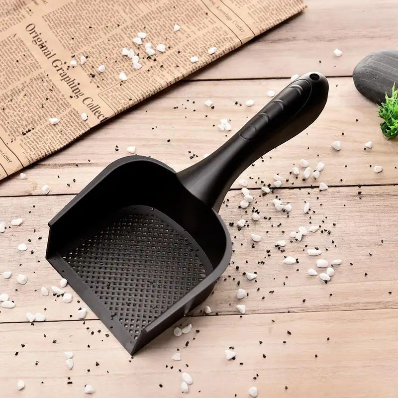 Black plastic cat litter scoop with perforated tray in an angled view and long handle