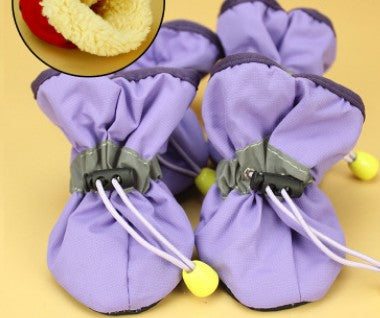 Lavender soft dog boots with white laces and yellow sole studs