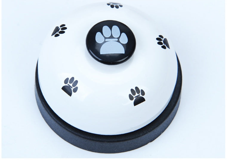 White paw press pet training bell base with black paw button in the center