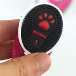 Dog shoe outsole close-up with red paw logo and PETRICH branding