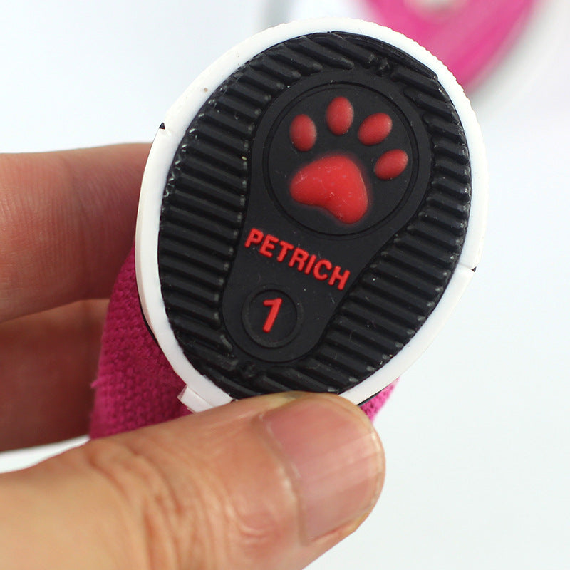 Dog shoe outsole close-up with red paw logo and PETRICH branding