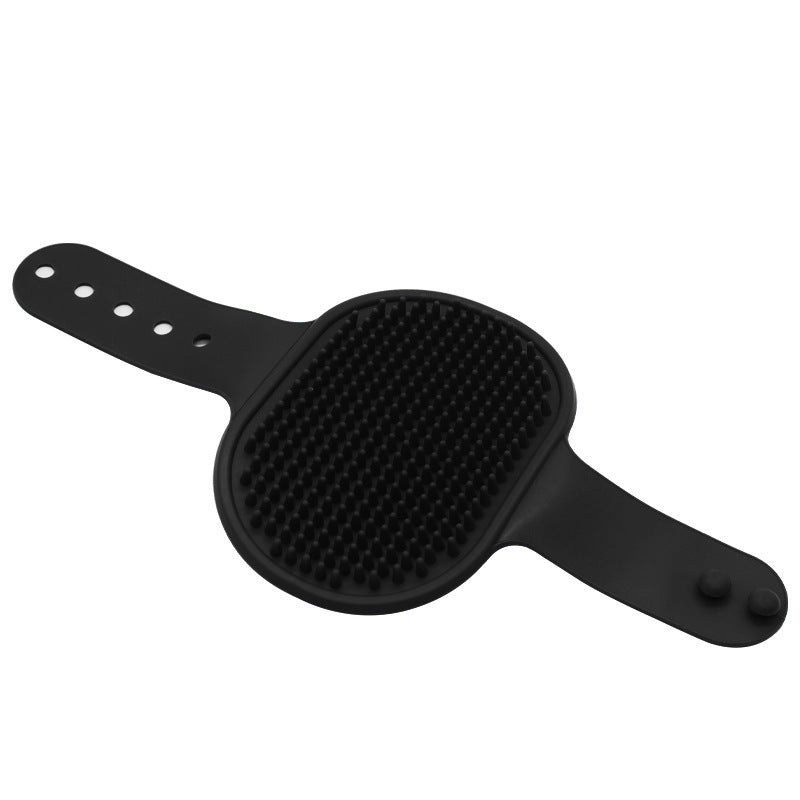 Black silicone pet grooming brush with raised rubber massage bristles