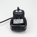 Black pump controller housing with label and upright outlet tube