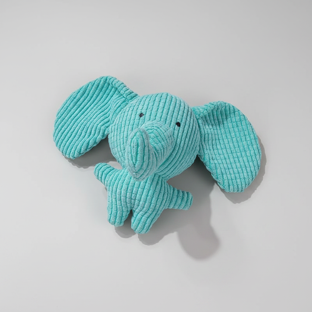 Turquoise elephant plush squeaky dog toy, side view with textured fabric and curled legs