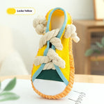 Locke Yellow squeaky plush shoe dog toy with yellow upper, blue straps, and rope knots
