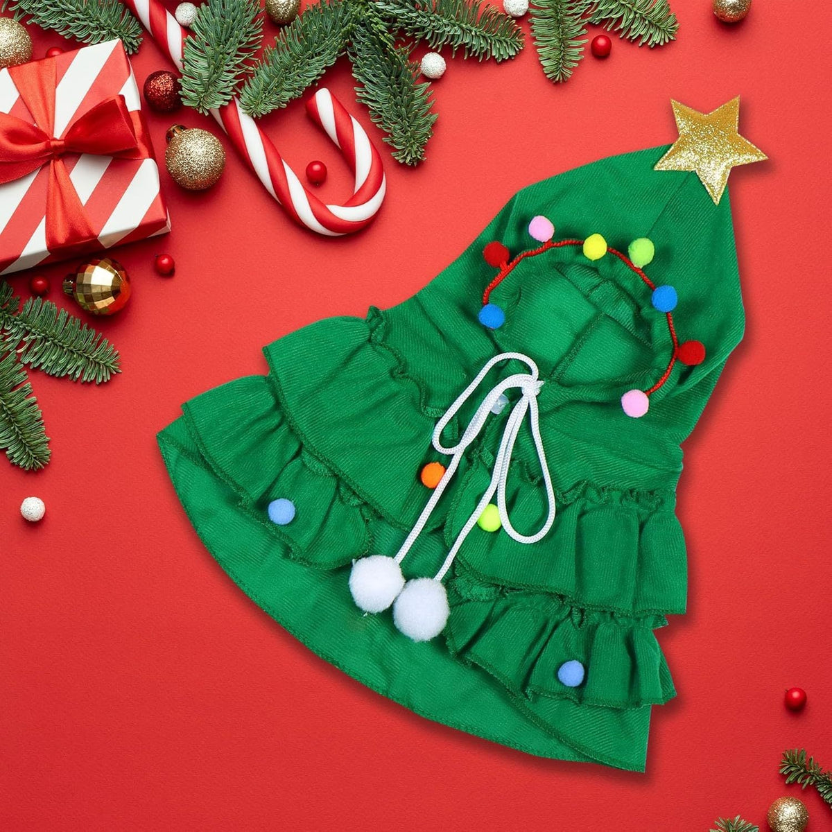 Green pet Christmas tree costume dress with gold star, multicolor pom-poms, and white ties