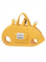 Yellow portable pet carrier harness with handle straps and front ID label pocket