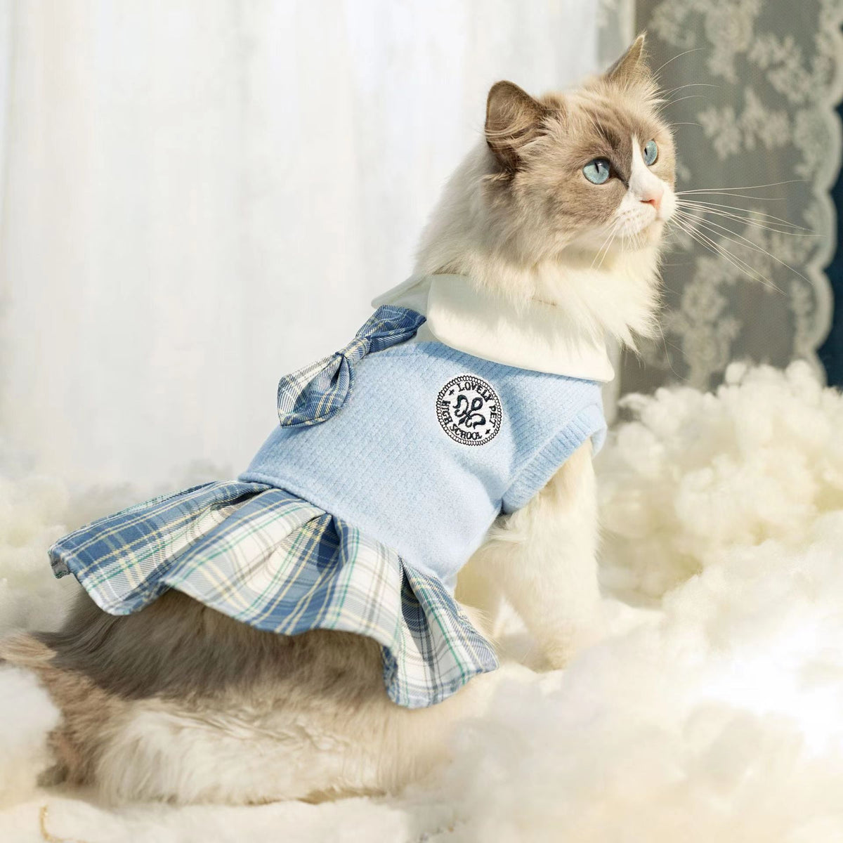 Pet cat outfit: light blue top with plaid bow and tartan skirt