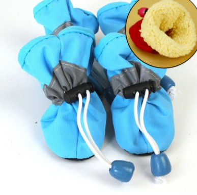 Blue soft dog boots with white laces and grippy sole, small pull tabs