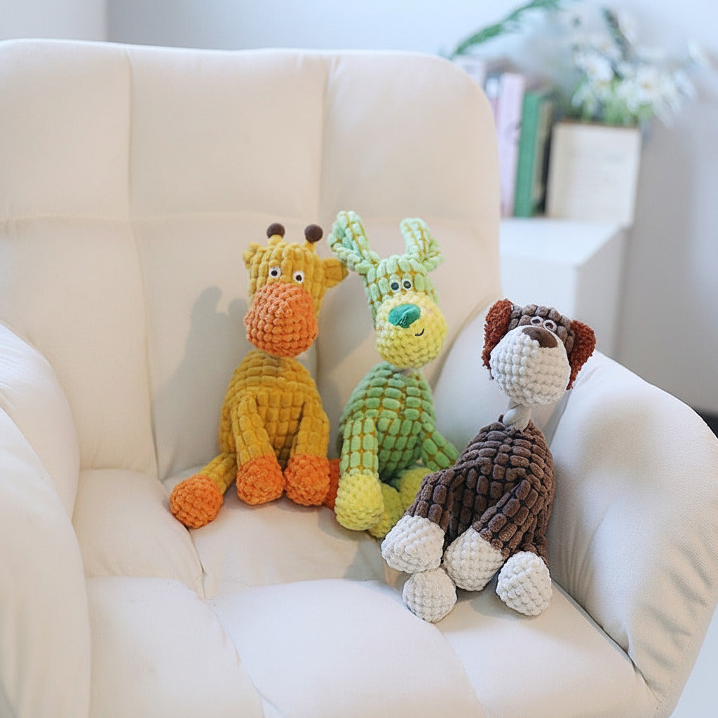 Plush animal dog toy set with multiple squeaky figures on a sofa, including a giraffe.