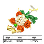 Parrot nibble toy: hanging rope ball with orange and green strands and gold bells