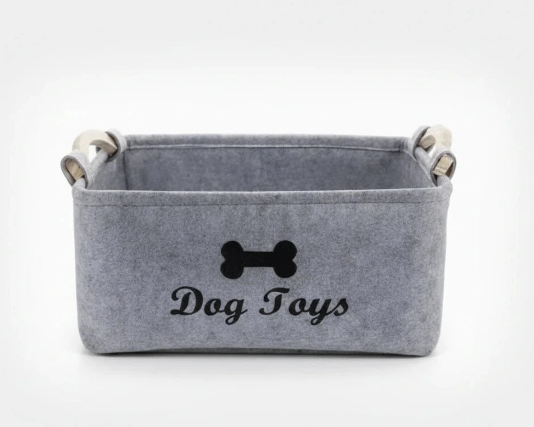 Light grey felt storage basket with dog bone emblem and side handles