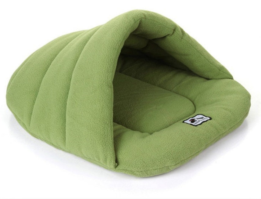 Green pet cave sleeping bag with rounded hood and logo patch