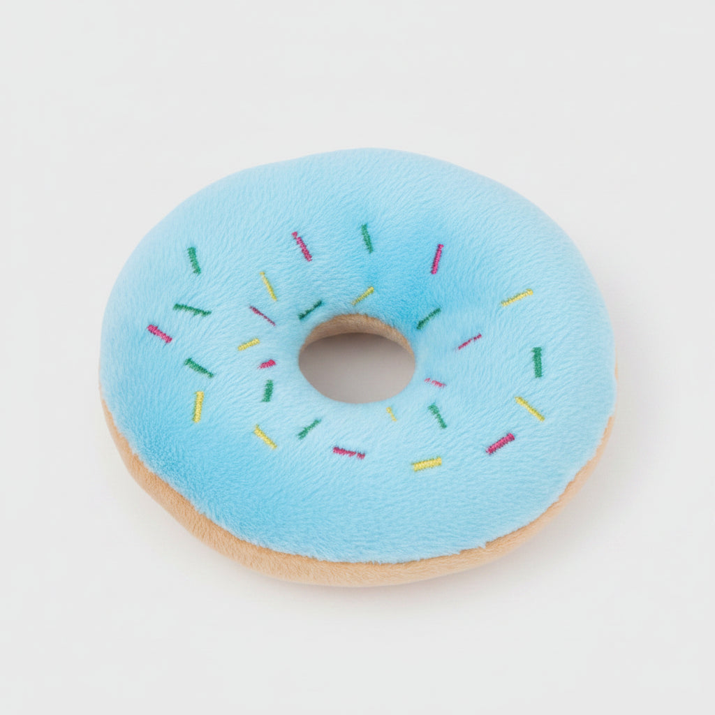 Blue plush donut dog toy with rainbow sprinkles and round center hole