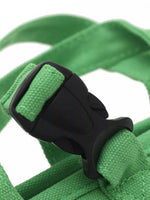 Green portable pet carrier harness with black buckle and secure strap connector