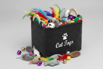Dark grey felt storage basket with paw-print logo and handles, filled with cat toys