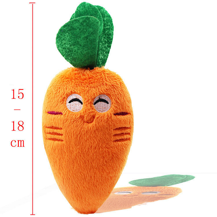 Carrot-shaped plush squeaky pet toy with green leafy top and orange body