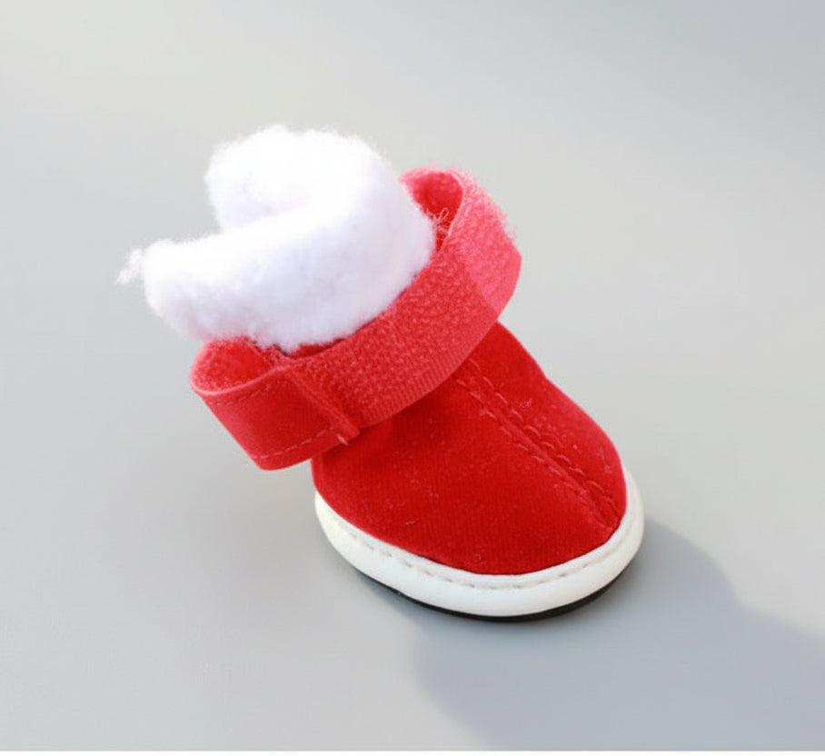 Red pet Christmas shoe with white fuzzy cuff and Velcro strap, front corner view