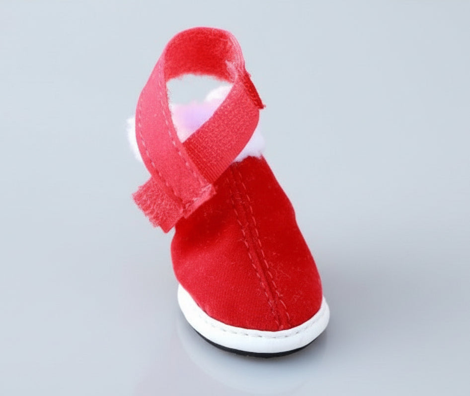 Red pet Christmas boot sneaker with white fuzzy cuff and Velcro strap, side view
