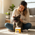 Organic coconut oil for pets jar with yellow label beside black-and-white dog