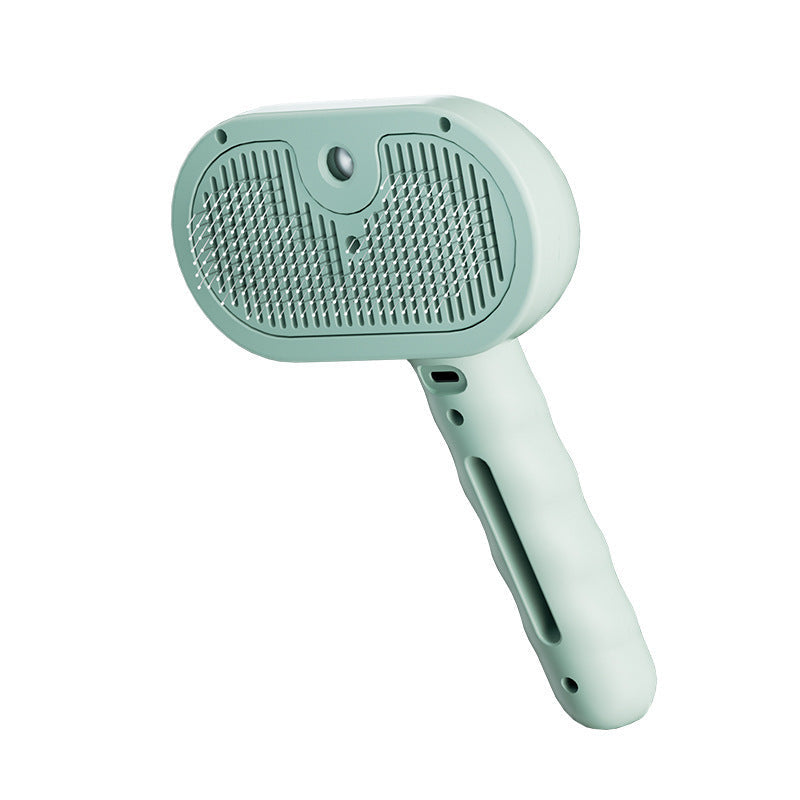 Pet steam brush with mint-green handle and oval textured cleaning head