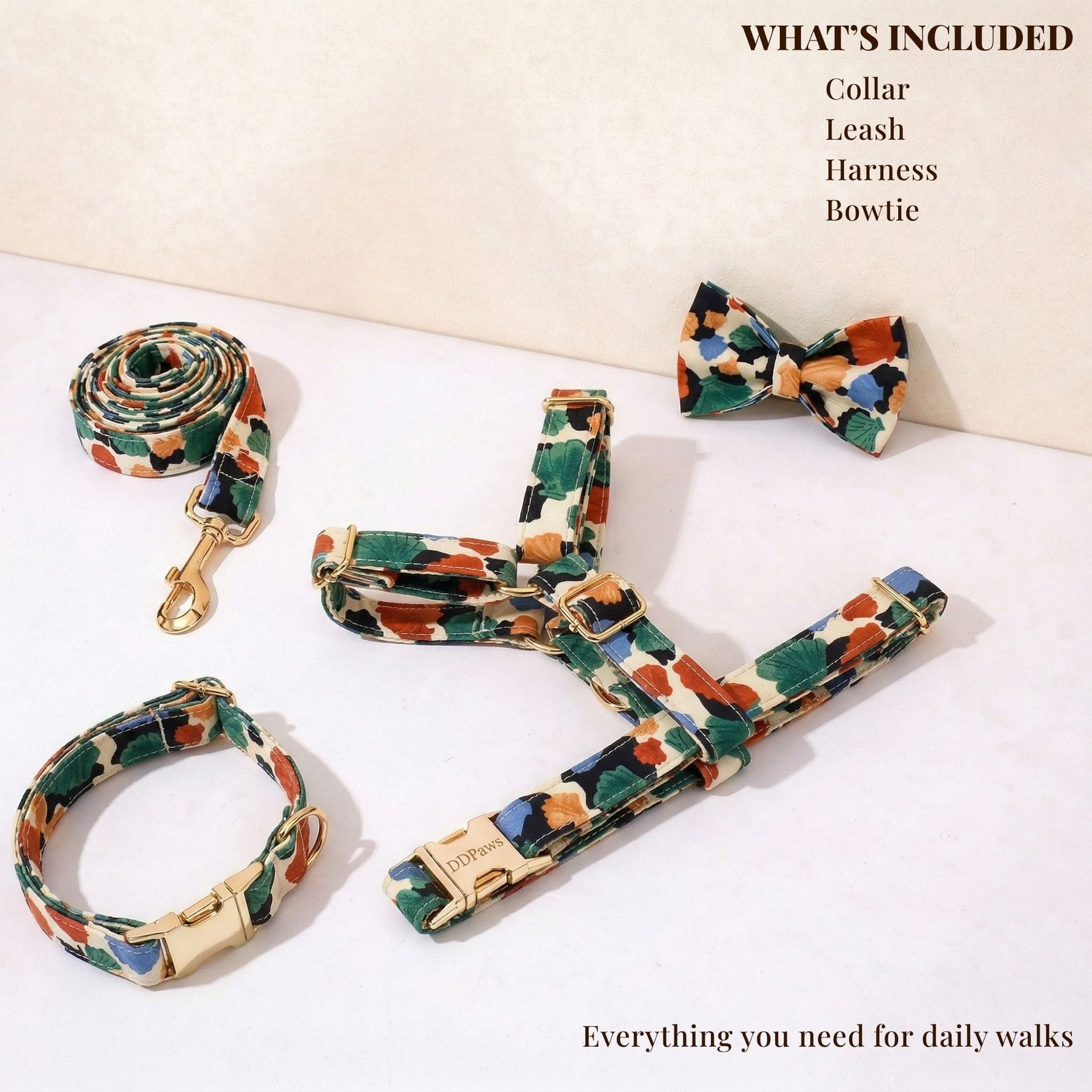 Dog collar, leash, and bowtie set with multicolor floral fabric and gold hardware