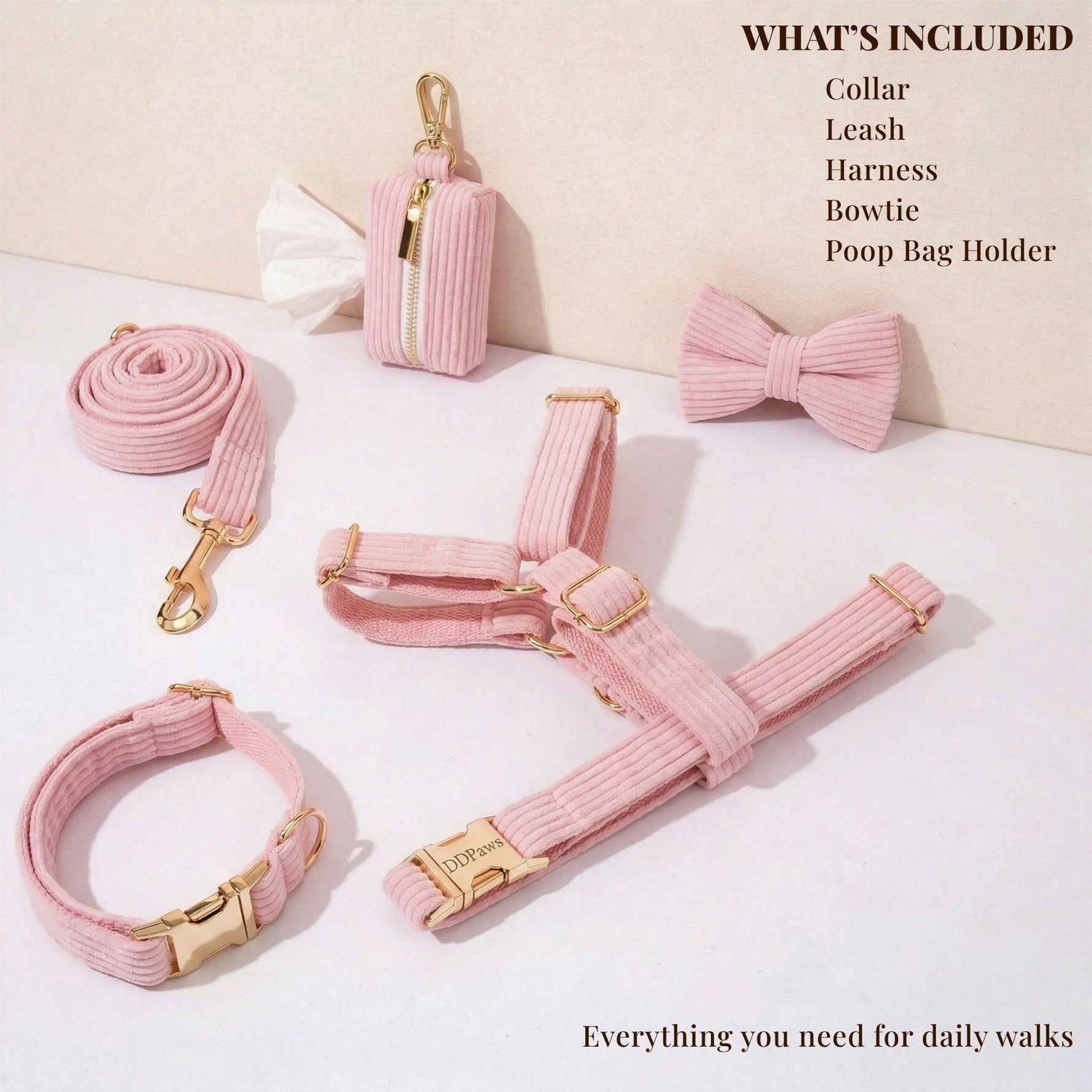 Pink corduroy dog leash and bowtie with collar and harness pieces, gold clasps
