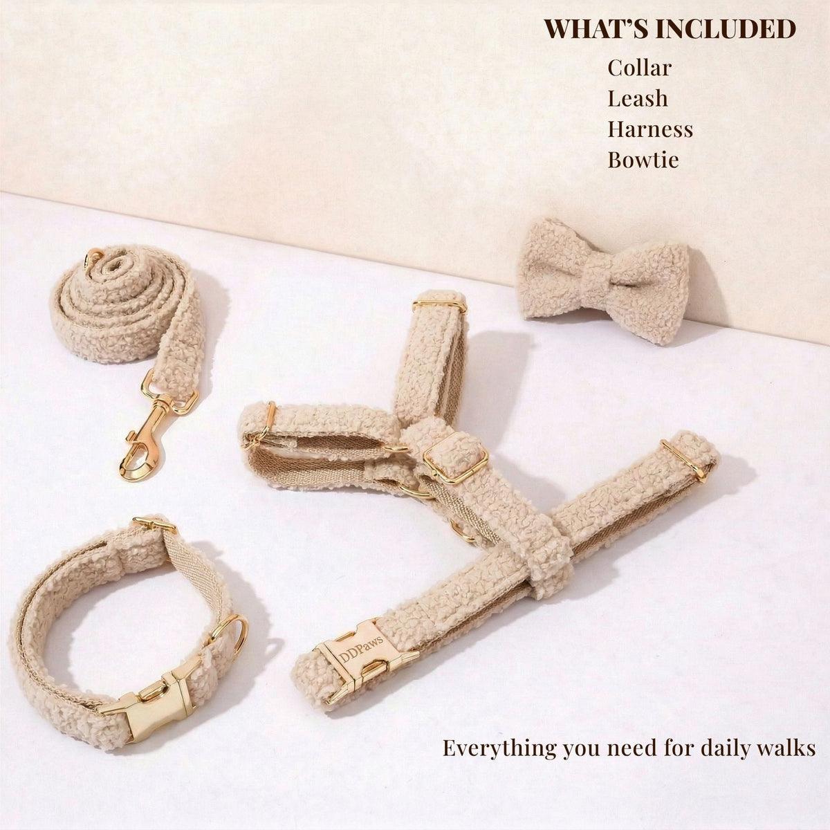 Beige teddy dog accessory set laid out: collar, leash, harness, and bowtie