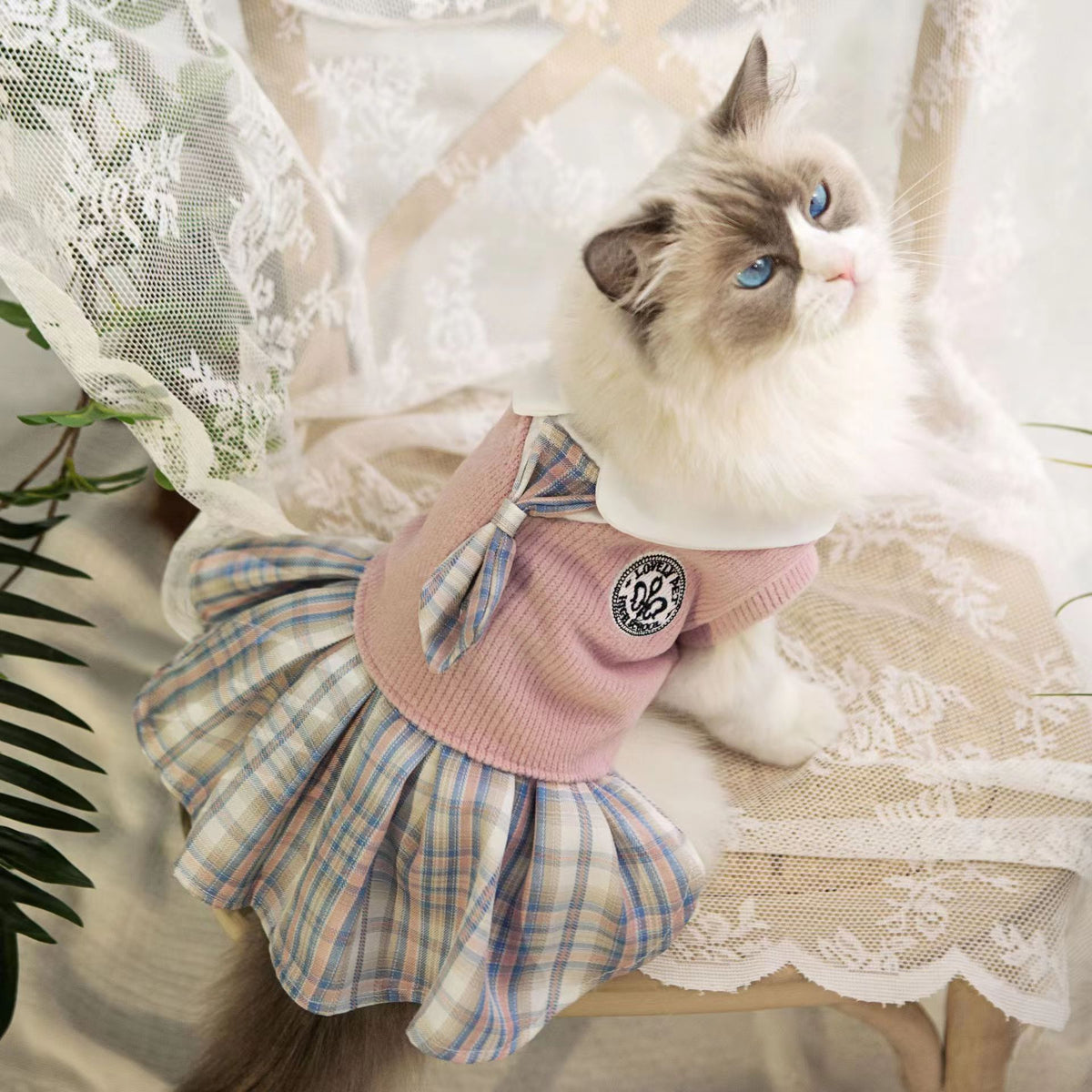 Pet cat outfit: pink top with plaid bow and blue tartan skirt