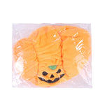 Pumpkin pet hat in clear bag, orange plush with jack-o-lantern face and green stem