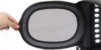Pet carrier mesh window with handle strap and zipper edge, close-up