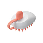 Silicone pet hair remover comb with white body and orange bristles, compact handheld brush