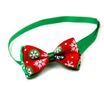Green and red Christmas pet bow tie with holiday print bows on green neck strap