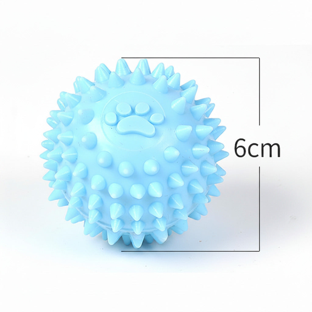 Light blue spiky dog throwing ball with raised paw print, 6 cm