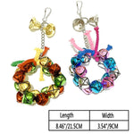Parrot nibble toy: colorful bell and chain chew ring with pink and blue accents