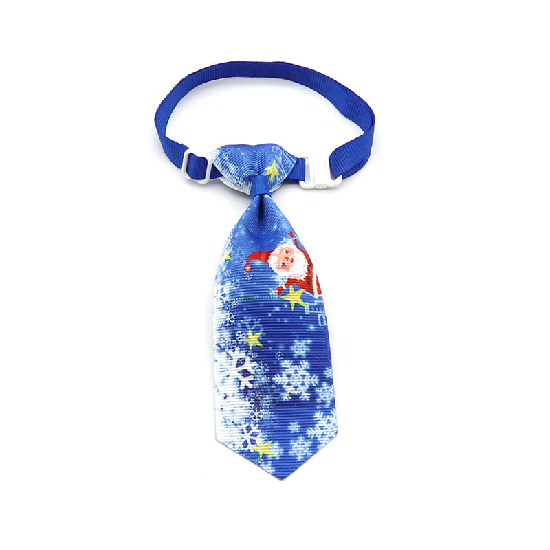 Light blue Christmas pet tie with star and snowflake patterns, clip-on strap