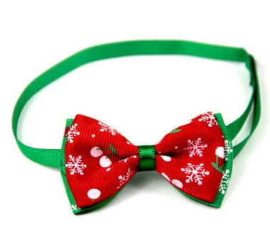 Red and green Christmas pet bow tie with snowflake and dot print on neck strap