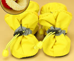 Yellow dog warm boots with gray anti-slip straps, drawstring top, soft lining