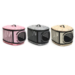 Three foldable pet carrier handbags in pink, gray, and beige with perforated sides