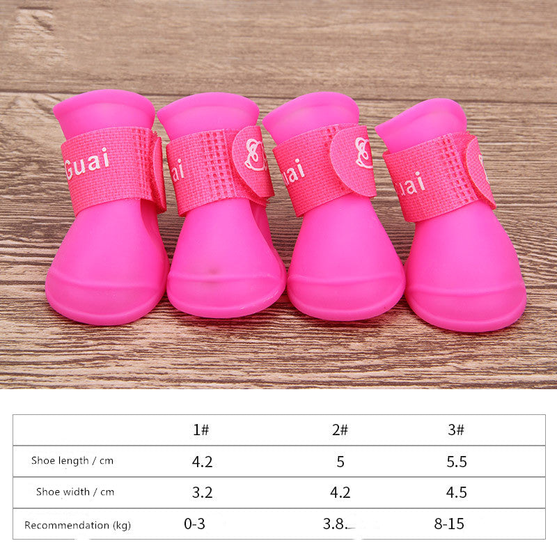 Pink dog soft-soled pet shoes with "Guai" text straps and hook closures