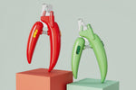 LED pet nail clippers with safety guard in red and green, open clamp and LED window
