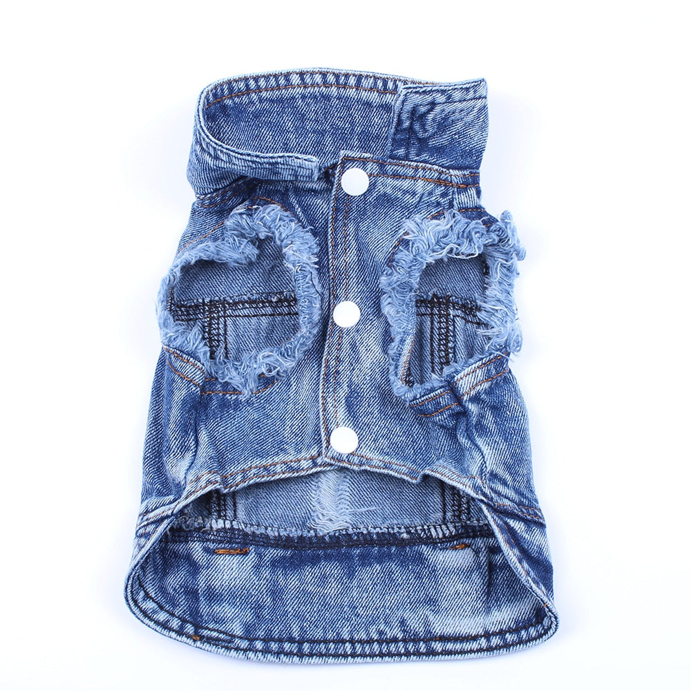 Blue denim pet jacket with layered distressed panels, three snap buttons, and side pockets